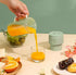 Small Electric Portable Fruit Juicer.